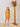 Short party dress with orange sleeves and gold polka dots